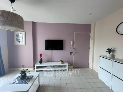 Modern living room with wall-mounted TV and stylish decor
