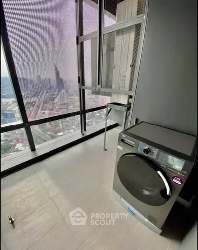 Modern high-rise balcony with washer and stunning city view