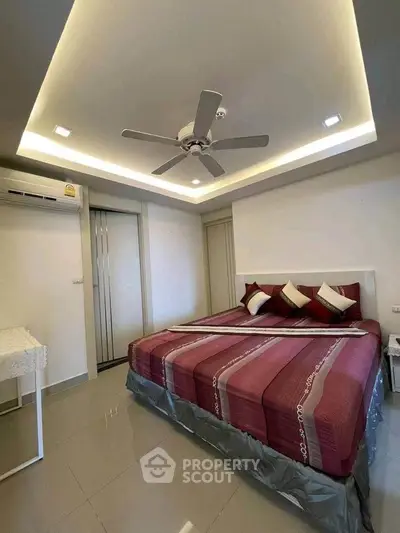 Modern bedroom with stylish ceiling fan and ambient lighting