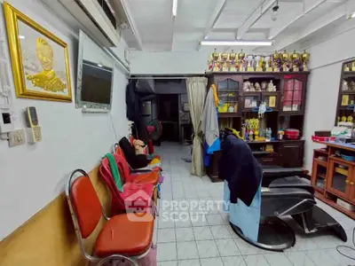 Charming vintage barber shop with eclectic decor and trophy display