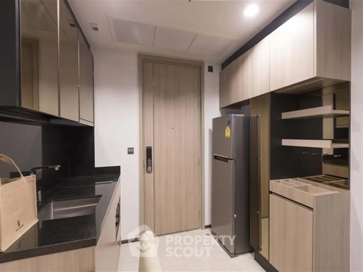 Modern kitchen with sleek cabinetry and stainless steel appliances