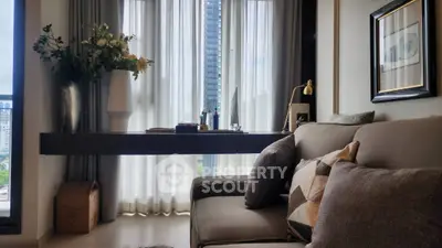 Stylish living room with modern decor and city view, featuring elegant sofa and chic wall art.