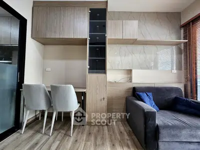 Modern living room with stylish furniture and wood accents