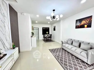 Elegant modern living room with stylish decor and open dining area