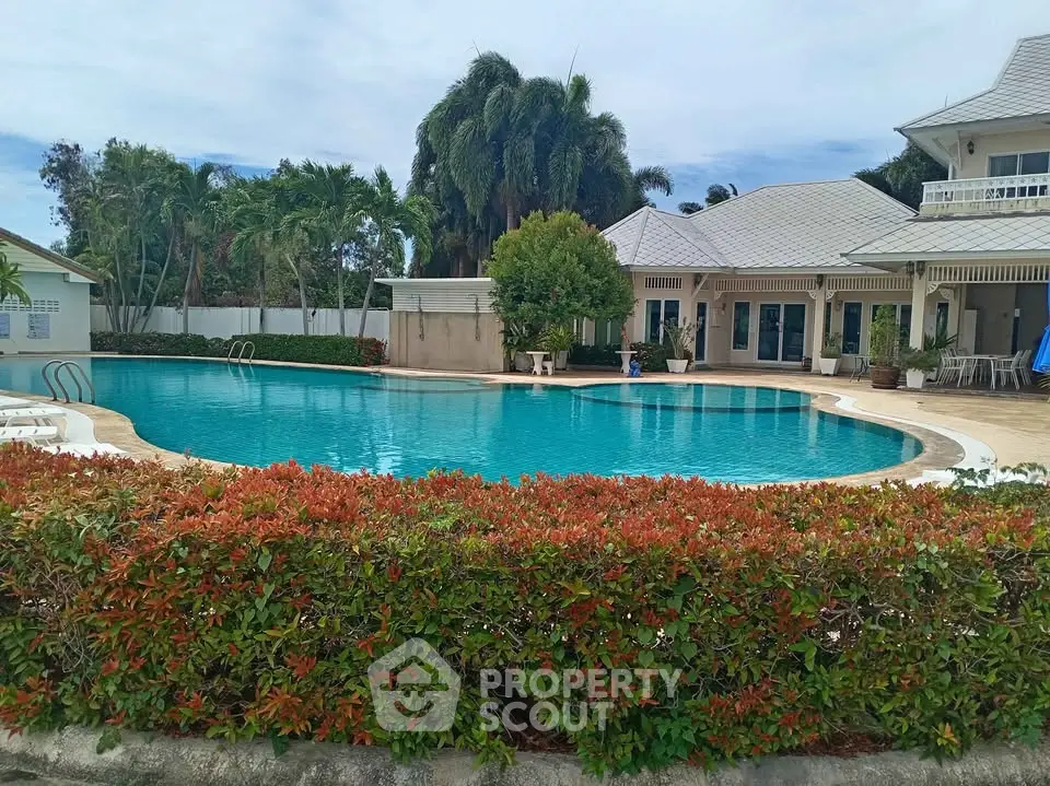 Luxurious property with stunning pool and lush landscaping, perfect for relaxation and entertainment.