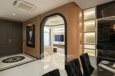 Luxurious modern living room with elegant decor and marble accents