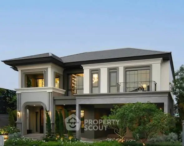 Elegant two-story modern house with lush garden and stylish facade