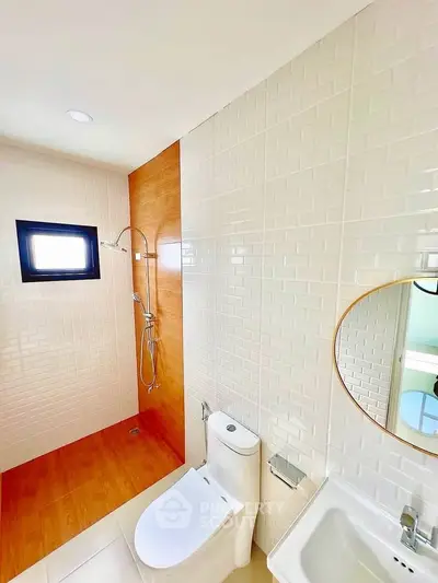 Modern bathroom with sleek shower and elegant fixtures