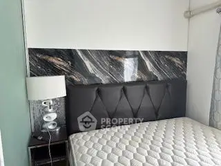 Modern bedroom with stylish headboard and comfortable mattress