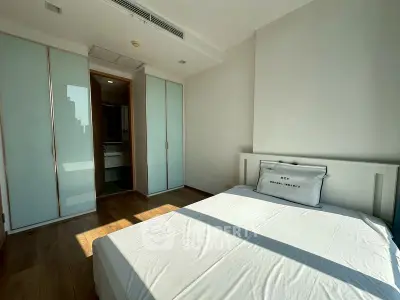 Bright and spacious bedroom with modern design and ample natural light.