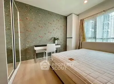 Chic bedroom with floral accent wall and city view, perfect for urban living.