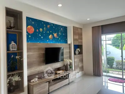 Modern living room with stylish TV unit and space-themed decor