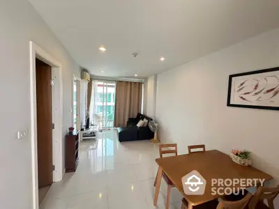 Modern living room with dining area and large window view