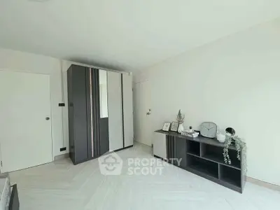 Modern minimalist bedroom with sleek wardrobe and stylish decor