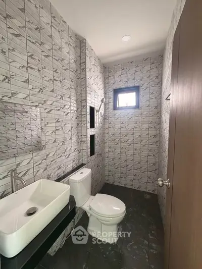 Modern bathroom with stylish tile design and contemporary fixtures