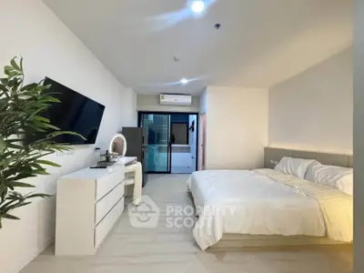Spacious modern bedroom with minimalist decor and large bed in a stylish apartment.