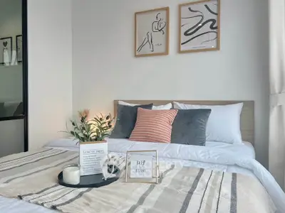 Cozy bedroom with stylish decor and natural light