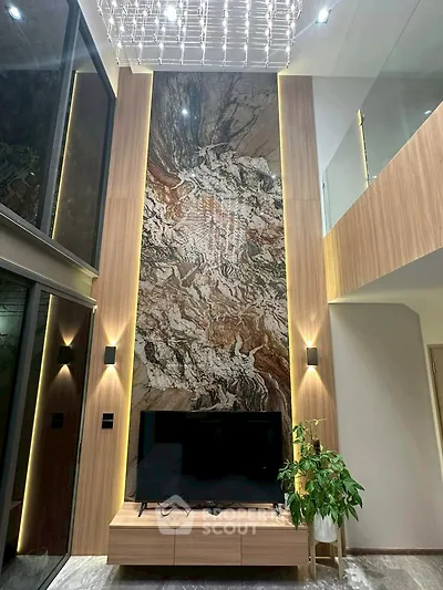 Luxurious modern living room with high ceiling, elegant wood paneling, and stunning marble feature wall.