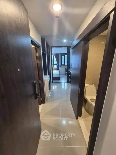 Modern apartment hallway with sleek design and bathroom access