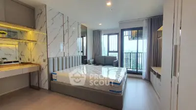 Modern bedroom with stylish decor and balcony view in luxury apartment