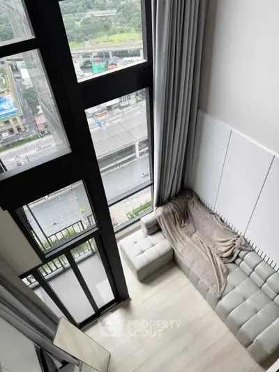 Stunning high-rise living room with floor-to-ceiling windows and city view