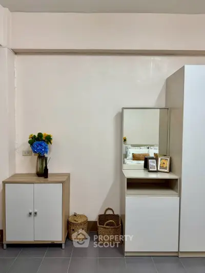 Cozy bedroom corner with modern furniture and decorative accents