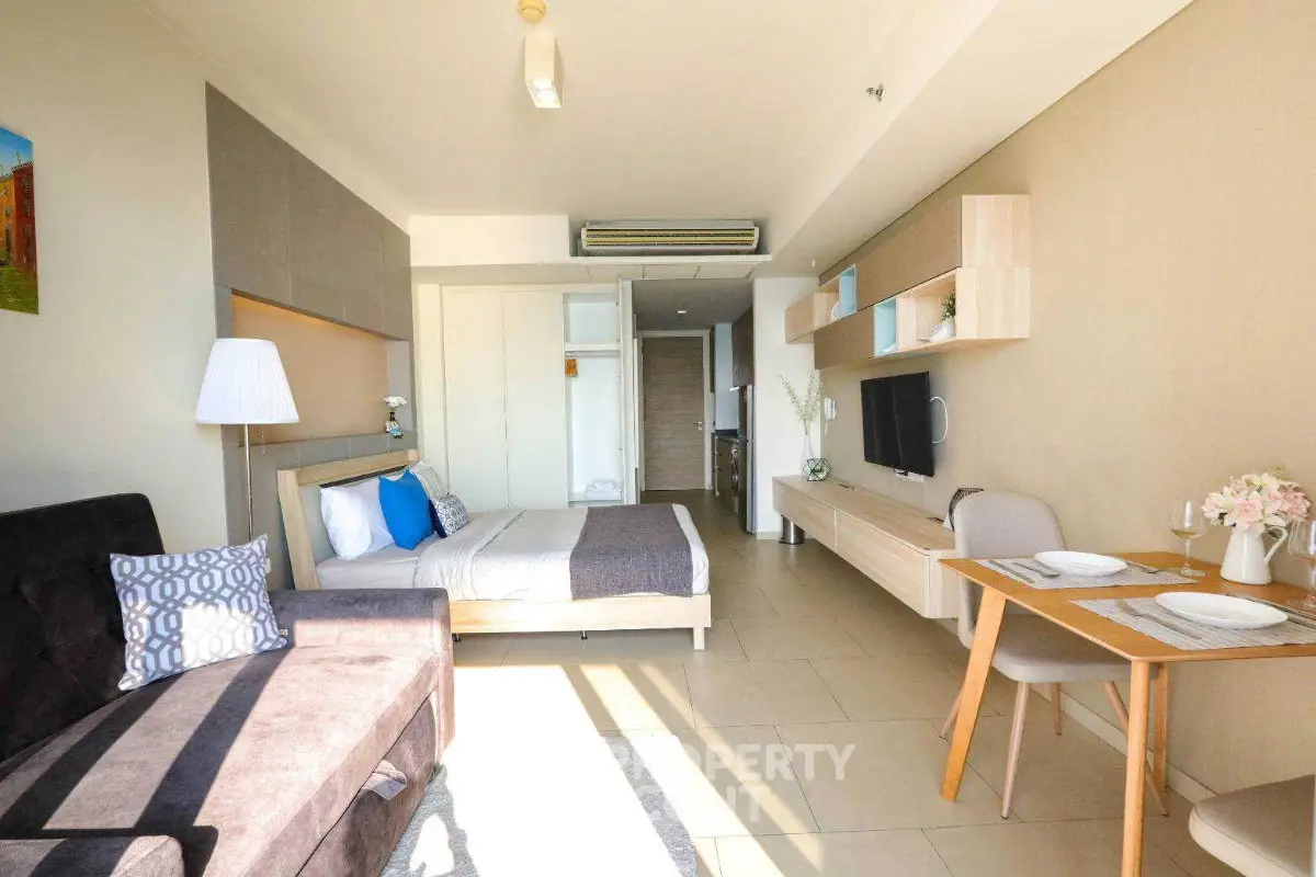 Modern studio apartment with cozy living area and stylish decor