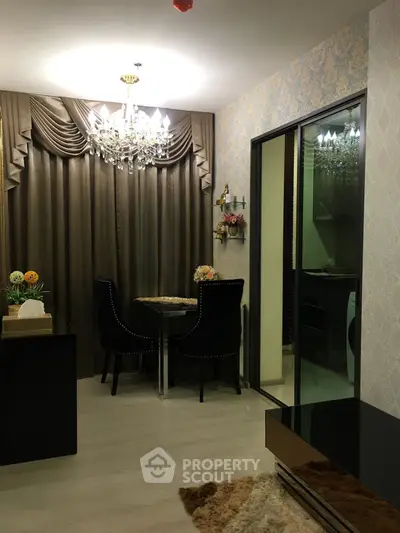 Elegant dining area with chandelier and stylish decor in modern apartment