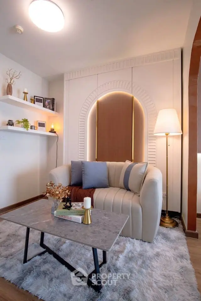 Chic living room with cozy sofa, elegant decor, and ambient lighting