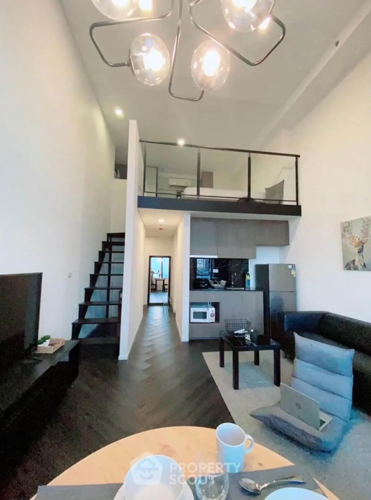 Modern loft apartment with open layout, stylish kitchen, and cozy living area