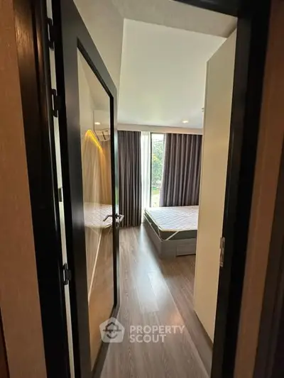 Modern bedroom with large window and stylish decor