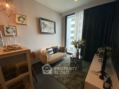 Stylish modern living room with cozy seating and elegant decor in a high-rise apartment.