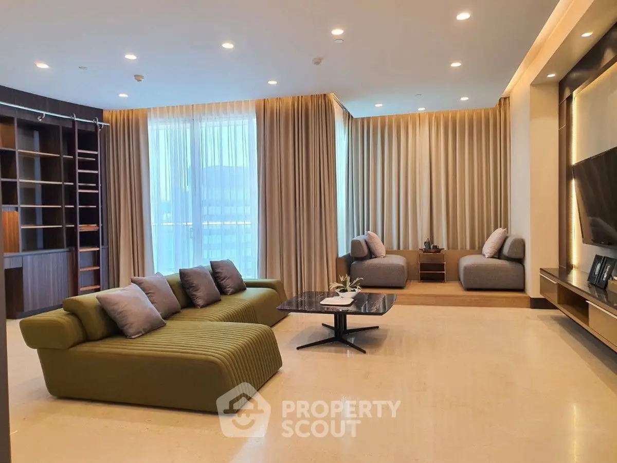 Luxurious modern living room with elegant furniture and large windows