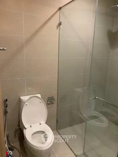 Modern bathroom with glass shower and sleek tile design