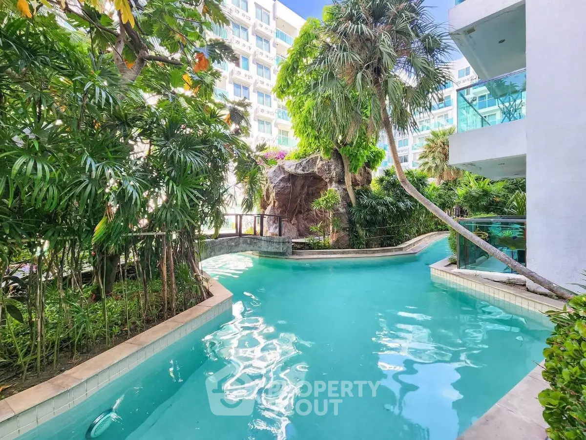 Luxurious tropical pool area with lush greenery and modern architecture