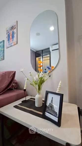 Stylish living room with modern decor and elegant mirror