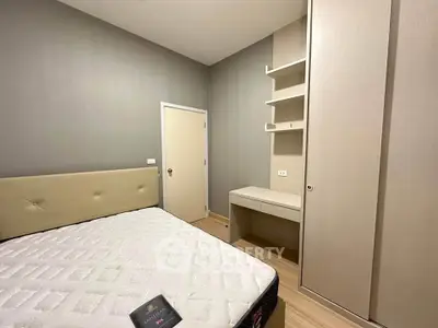 Cozy bedroom with built-in wardrobe and minimalist design, perfect for modern living.