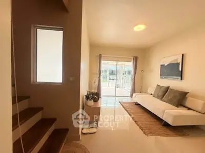 Spacious living room with modern decor and natural light