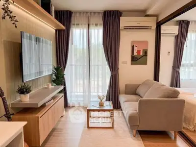 Modern living room with cozy sofa, wall-mounted TV, and large window with curtains.