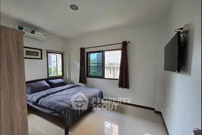 Cozy bedroom with modern decor and natural light
