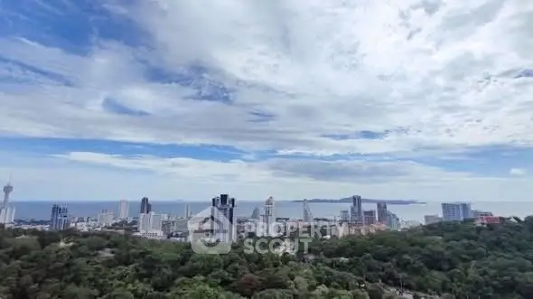 Stunning cityscape with ocean view and lush greenery
