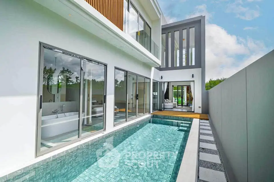 Luxurious modern home with private pool and sleek architectural design.
