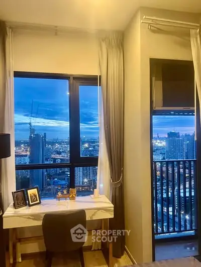 Stunning city view from a modern high-rise apartment study area.