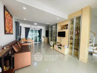 Spacious modern living room with sleek design and ample natural light, perfect for family gatherings.