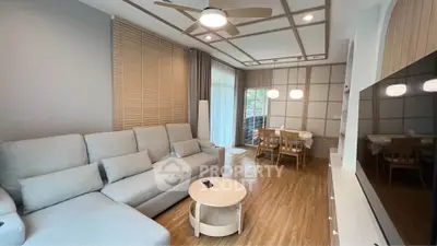 Modern living room with cozy sectional sofa and stylish dining area