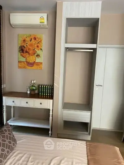 Cozy bedroom with air conditioning and stylish decor
