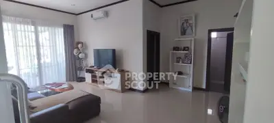 Spacious living room with modern decor and natural light