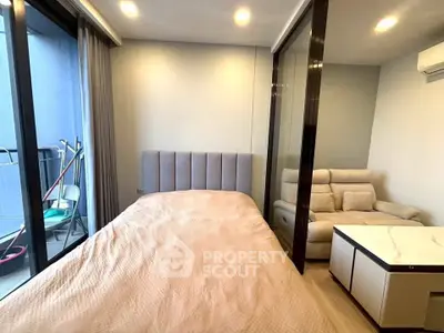 Modern bedroom with cozy bed and balcony access in stylish apartment