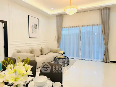 Elegant living room with modern decor and large windows for natural light.