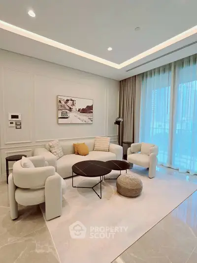 Luxurious modern living room with elegant furniture and large windows